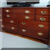 F31. Henkel Harris mahogany 10-drawer triple dresser with mirror. 34” x 66”w x 21”d - $795